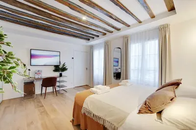 Un ou plusieurs lits dans un hébergement de l'établissement Modern apartment - 3BR 8P - Le Marais Bastille