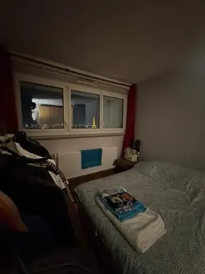 Un ou plusieurs lits dans un hébergement de l'établissement Eiffel Tower view & Swimming Pool, Cosy appartment - Center