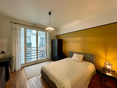 Un ou plusieurs lits dans un hébergement de l'établissement Tour Eiffel Quai de Seine Marois Paris