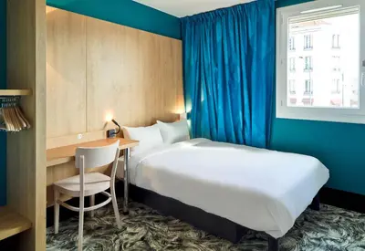 Un ou plusieurs lits dans un hébergement de l'établissement B&B HOTEL Paris Porte de la Villette