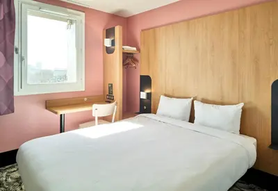 Un ou plusieurs lits dans un hébergement de l'établissement B&B HOTEL Paris Porte de la Villette