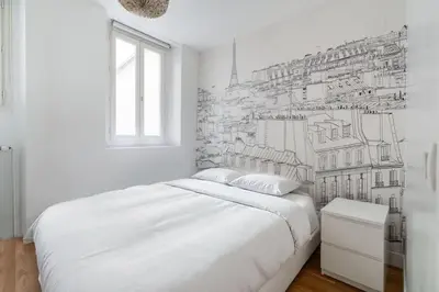 Un ou plusieurs lits dans un hébergement de l'établissement Sublime appartement Marais