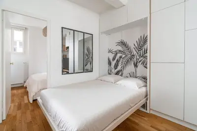 Un ou plusieurs lits dans un hébergement de l'établissement Sublime appartement Marais