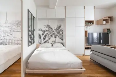 Un ou plusieurs lits dans un hébergement de l'établissement Sublime appartement Marais