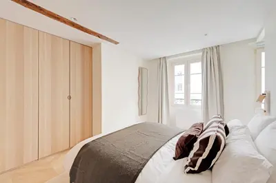 Un ou plusieurs lits dans un hébergement de l'établissement Sublime appartement à deux pas de Bastille