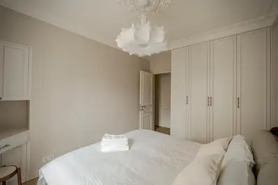 Un ou plusieurs lits dans un hébergement de l'établissement Appartement T4 Porte de Versailles