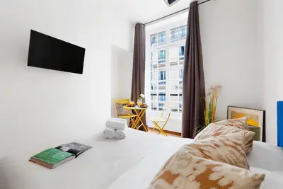 Un ou plusieurs lits dans un hébergement de l'établissement Serenty - Le Marais Studio - Place des Vosges