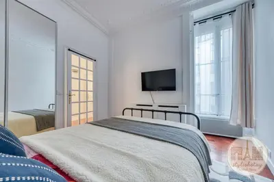 Un ou plusieurs lits dans un hébergement de l'établissement Appartement Élégant Paris 8e, quartier Champs-Élysées