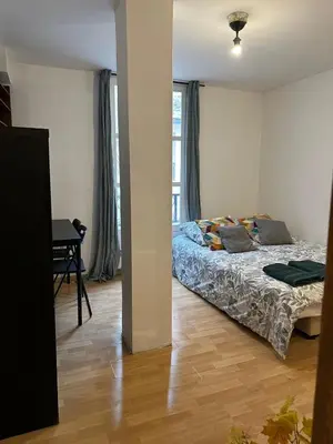 Un ou plusieurs lits dans un hébergement de l'établissement Apartamento en paris