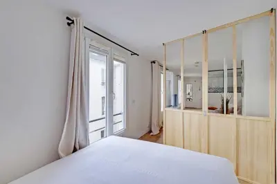 Un ou plusieurs lits dans un hébergement de l'établissement Cozy Studio 2P - Hôtel de Ville