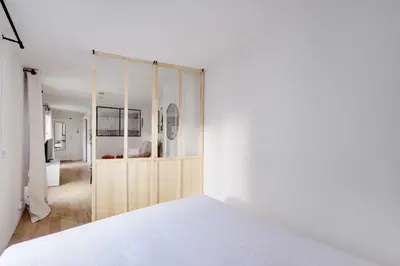 Un ou plusieurs lits dans un hébergement de l'établissement Cozy Studio 2P - Hôtel de Ville