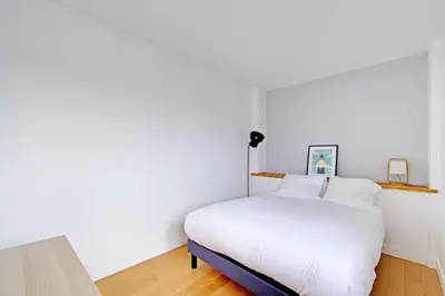 Un ou plusieurs lits dans un hébergement de l'établissement Charming Apartment 1BR 2P - Paris 12