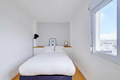 Un ou plusieurs lits dans un hébergement de l'établissement Charming Apartment 1BR 2P - Paris 12
