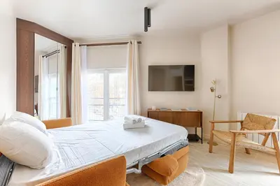 Télévision ou salle de divertissement dans l'établissement Sublime appartement Rue Royale