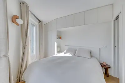 Un ou plusieurs lits dans un hébergement de l'établissement Appartement Lamarck Luxury