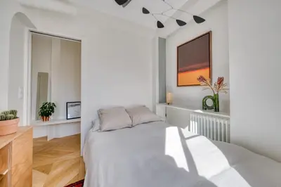 Un ou plusieurs lits dans un hébergement de l'établissement Appartement Lamarck Luxury