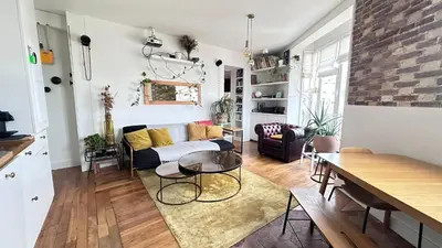 Coin salon dans l'établissement Cosy 1-Bedroom Apartment Near Montmartre