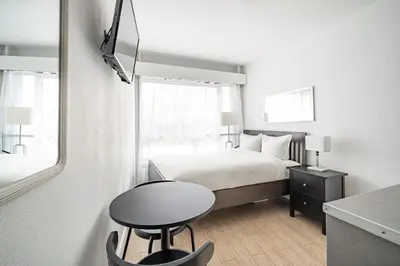Un ou plusieurs lits dans un hébergement de l'établissement Cozy studio Eiffel Tower et Beaugrenelle