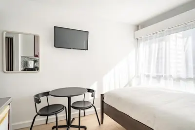 Un ou plusieurs lits dans un hébergement de l'établissement Cozy studio Eiffel Tower et Beaugrenelle