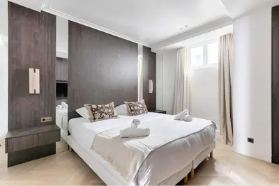 Un ou plusieurs lits dans un hébergement de l'établissement Luxury Apartment Sentier Montorgueil I