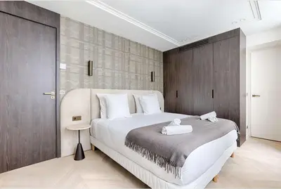Un ou plusieurs lits dans un hébergement de l'établissement Appartement de Luxe Sentier Louvre II