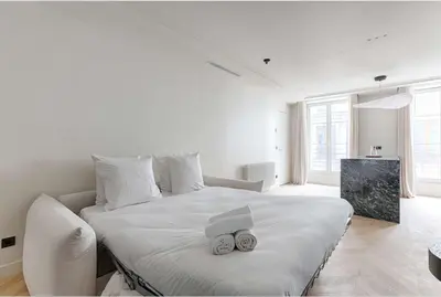 Un ou plusieurs lits dans un hébergement de l'établissement Appartement de Luxe Sentier Louvre II