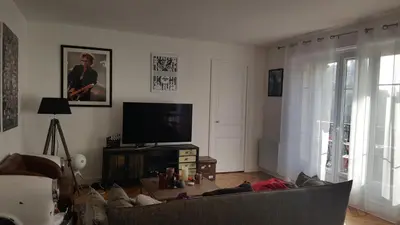 Télévision ou salle de divertissement dans l'établissement Appartement Haussmannien