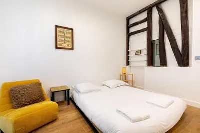 Un ou plusieurs lits dans un hébergement de l'établissement GuestReady - Modern Comfort in Montparnasse