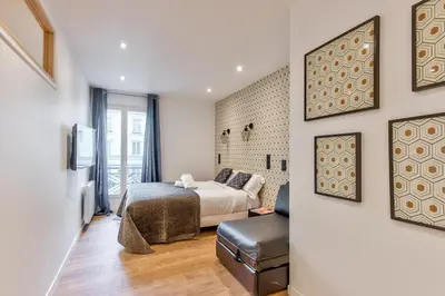 Un ou plusieurs lits dans un hébergement de l'établissement UrbanFlat 104 - Grand Apartment Paris Opera
