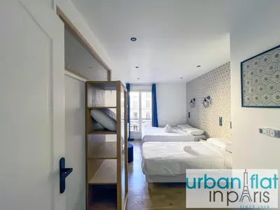 Un ou plusieurs lits dans un hébergement de l'établissement UrbanFlat 104 - Grand Apartment Paris Opera