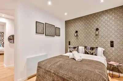 Un ou plusieurs lits dans un hébergement de l'établissement UrbanFlat 104 - Grand Apartment Paris Opera