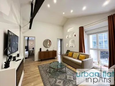 Télévision ou salle de divertissement dans l'établissement UrbanFlat 161 - Grand Appartement Central Rue de Paradis