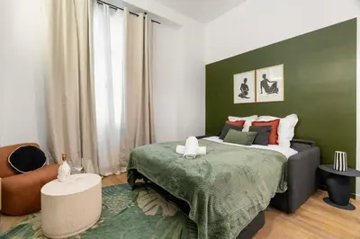Un ou plusieurs lits dans un hébergement de l'établissement Charming Parisian studio