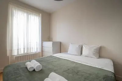 Un ou plusieurs lits dans un hébergement de l'établissement Elegant appartement avec ascenseur proche de la Tour Eiffel