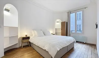 Un ou plusieurs lits dans un hébergement de l'établissement Superbe Appartements Bourdonnais Tour Eiffel