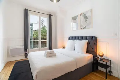 Un ou plusieurs lits dans un hébergement de l'établissement Elegant deux pieces - Paris 15e