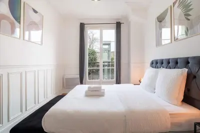 Un ou plusieurs lits dans un hébergement de l'établissement Elegant deux pieces - Paris 15e