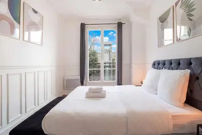 Un ou plusieurs lits dans un hébergement de l'établissement Elegant deux pieces - Paris 15e