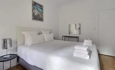 Un ou plusieurs lits dans un hébergement de l'établissement Superbe Appartements Champs Elysees Wagram