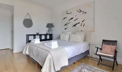 Un ou plusieurs lits dans un hébergement de l'établissement Superbe Appartements Champs Elysees Wagram