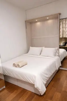 Un ou plusieurs lits dans un hébergement de l'établissement Charmant appartement en pierre proche de Notre dame de Paris