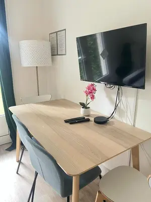 Télévision ou salle de divertissement dans l'établissement Appartement familial RDC