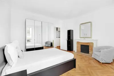 Un ou plusieurs lits dans un hébergement de l'établissement Superbe Appartements Tour Eiffel Suffren