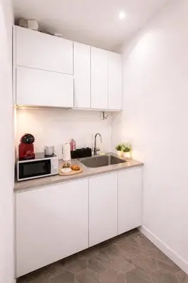 Cuisine ou kitchenette dans l'établissement HSH - Passage Saint Michel