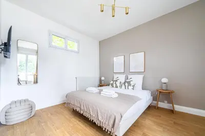 Un ou plusieurs lits dans un hébergement de l'établissement Cozy Studio in the Heart of Issy Close to Paris