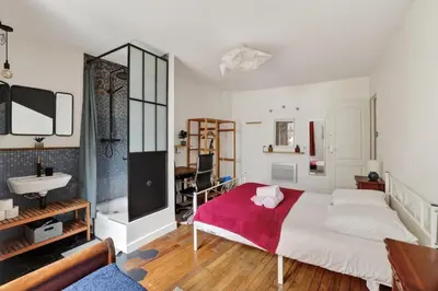 Un ou plusieurs lits dans un hébergement de l'établissement Premium 1BR flat with direct access to the RER B