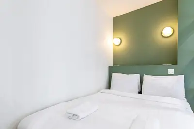 Un ou plusieurs lits dans un hébergement de l'établissement GuestReady - Parisian Charm near the Eiffel Tower
