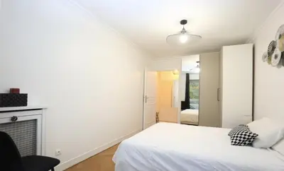 Un ou plusieurs lits dans un hébergement de l'établissement Superbe Appartements Tour Eiffel Grenelle