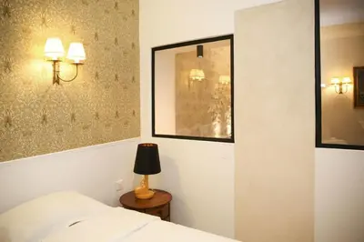 Un ou plusieurs lits dans un hébergement de l'établissement Magnifique appartement familial grand boulevard-6P