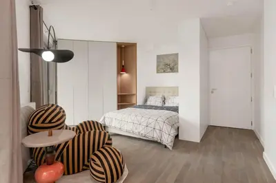 Un ou plusieurs lits dans un hébergement de l'établissement Studio Premium Moderne avec Balcon - Parc des Expositions
